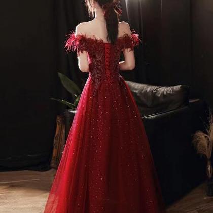 Long ,Burgundy prom gown,off should..