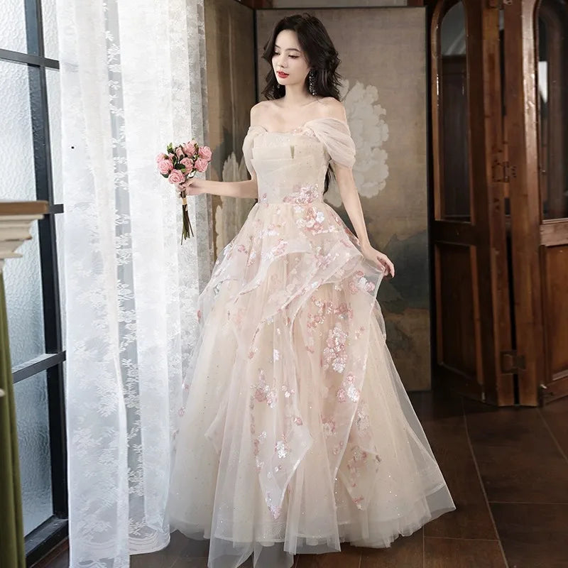 embroidered tulle overlay dress Strapless fully embroidered sequin dress with black tulle overlay